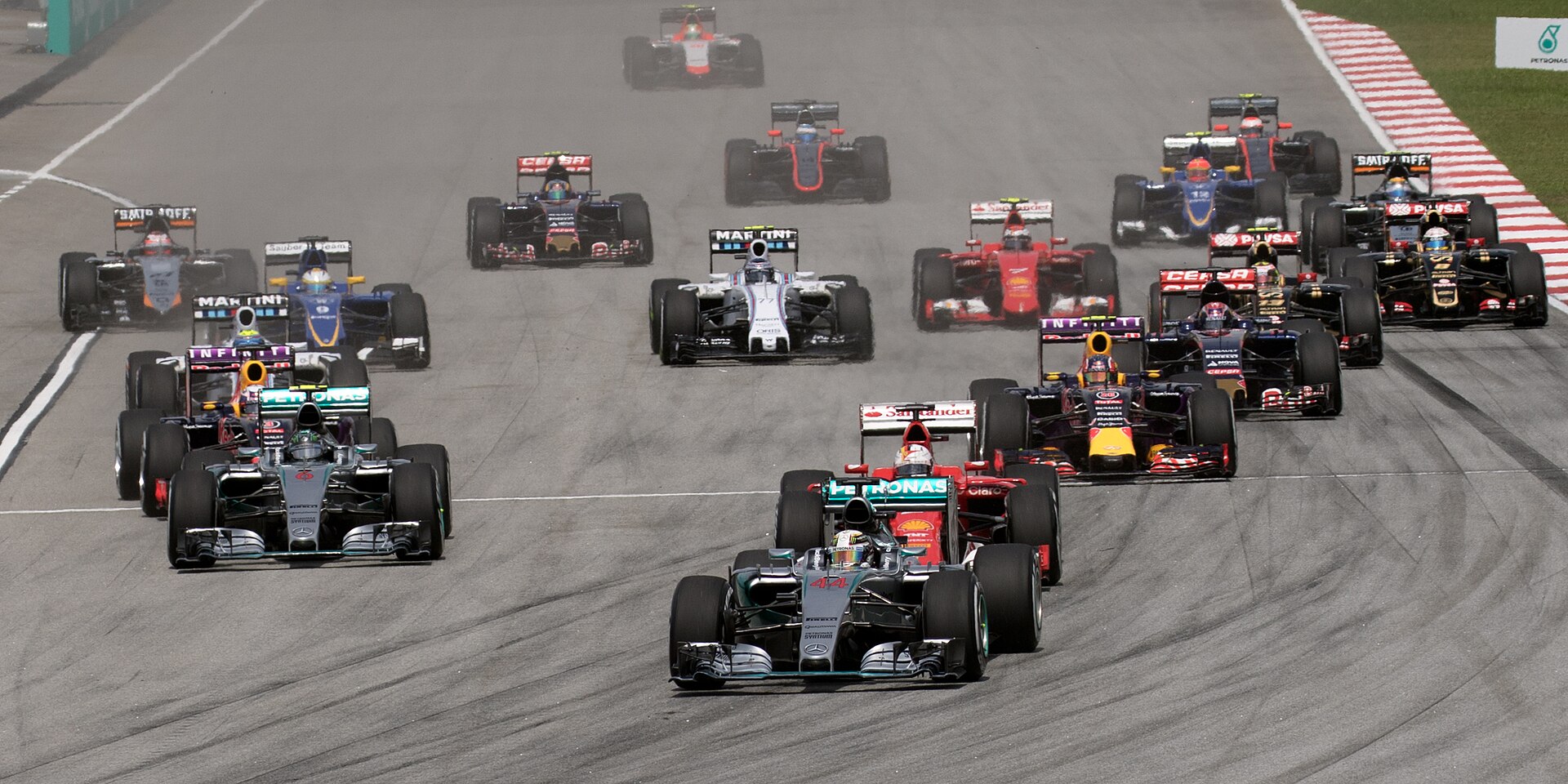 Formula One cars racing at Sepang International Circuit